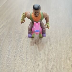 Dynamic Action Figure with Pink and Green Details